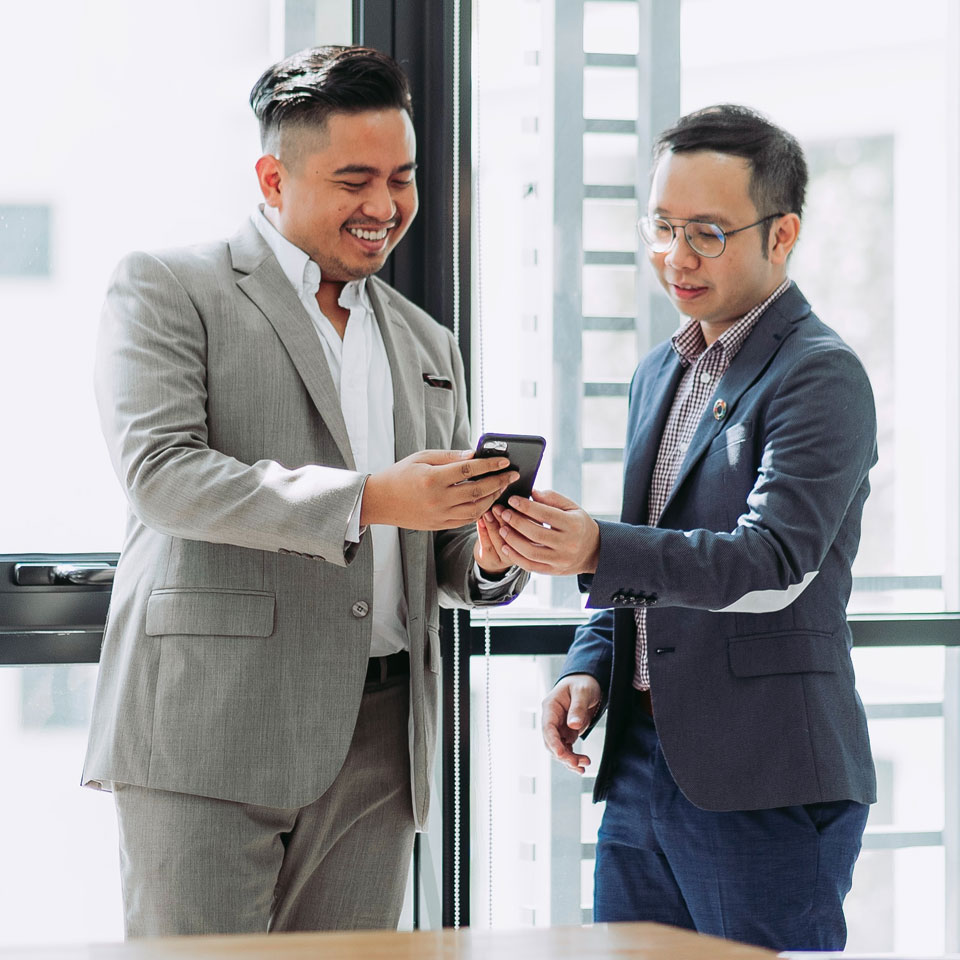Two company directors meeting to agree a written plan