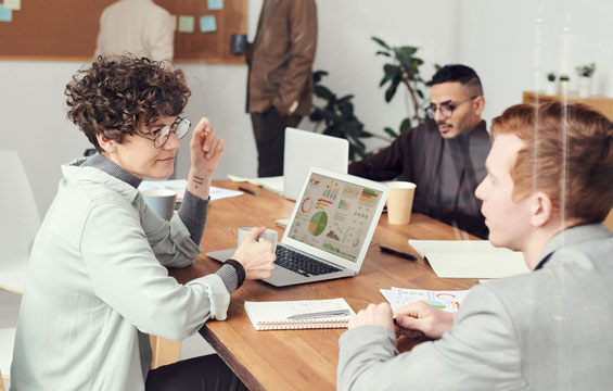 Team reviewing workflow changes together in a meeting room